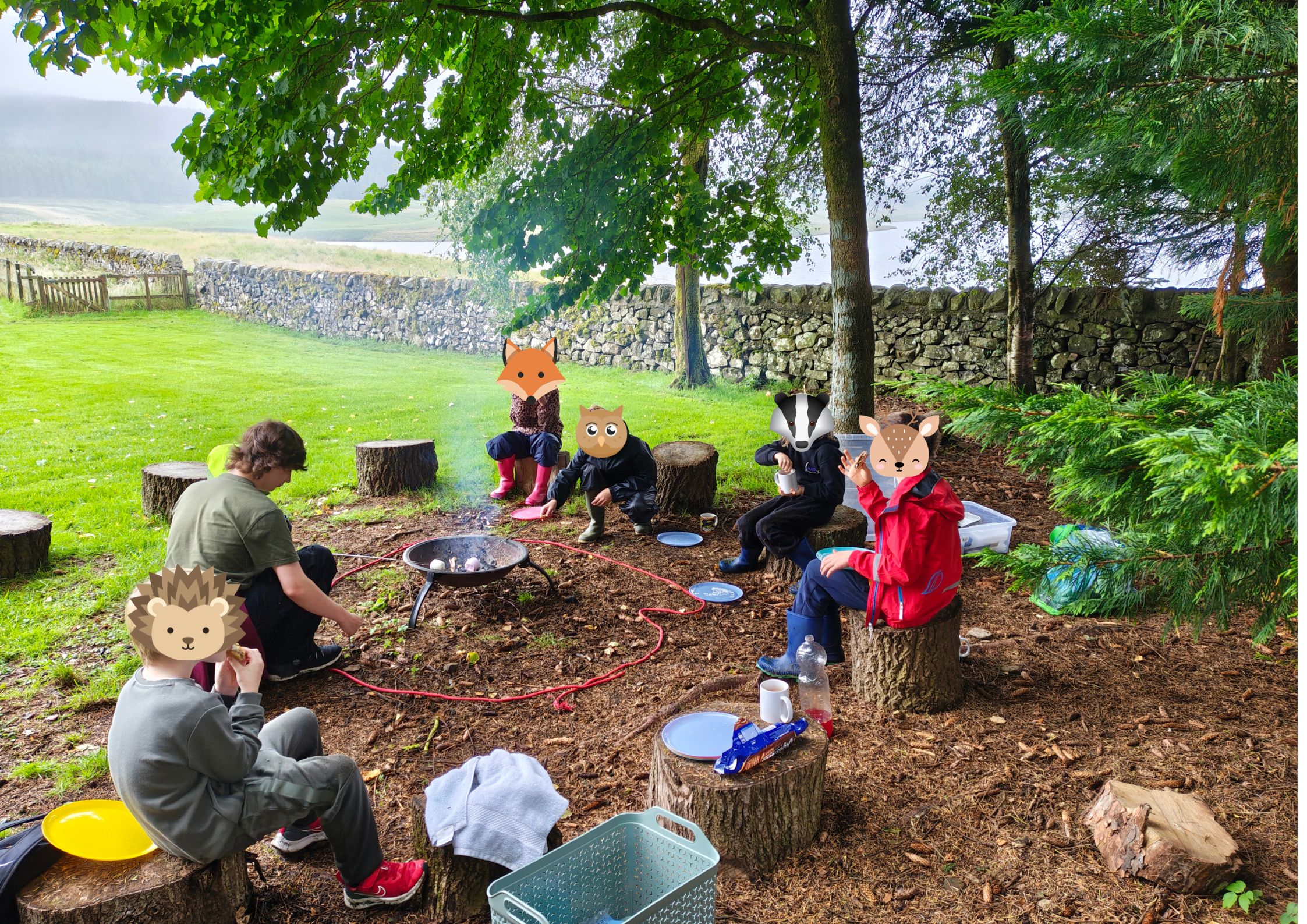 children around campfire with animal faces