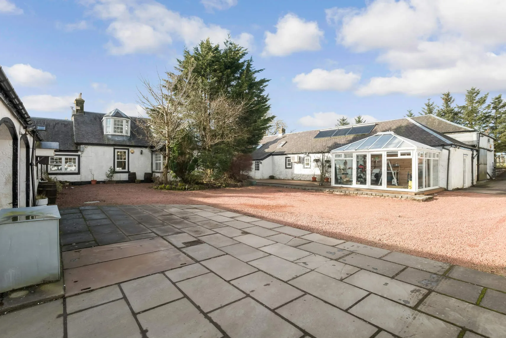 Alaria CIC courtyard with conservatory for therapeutic forest school waiting area