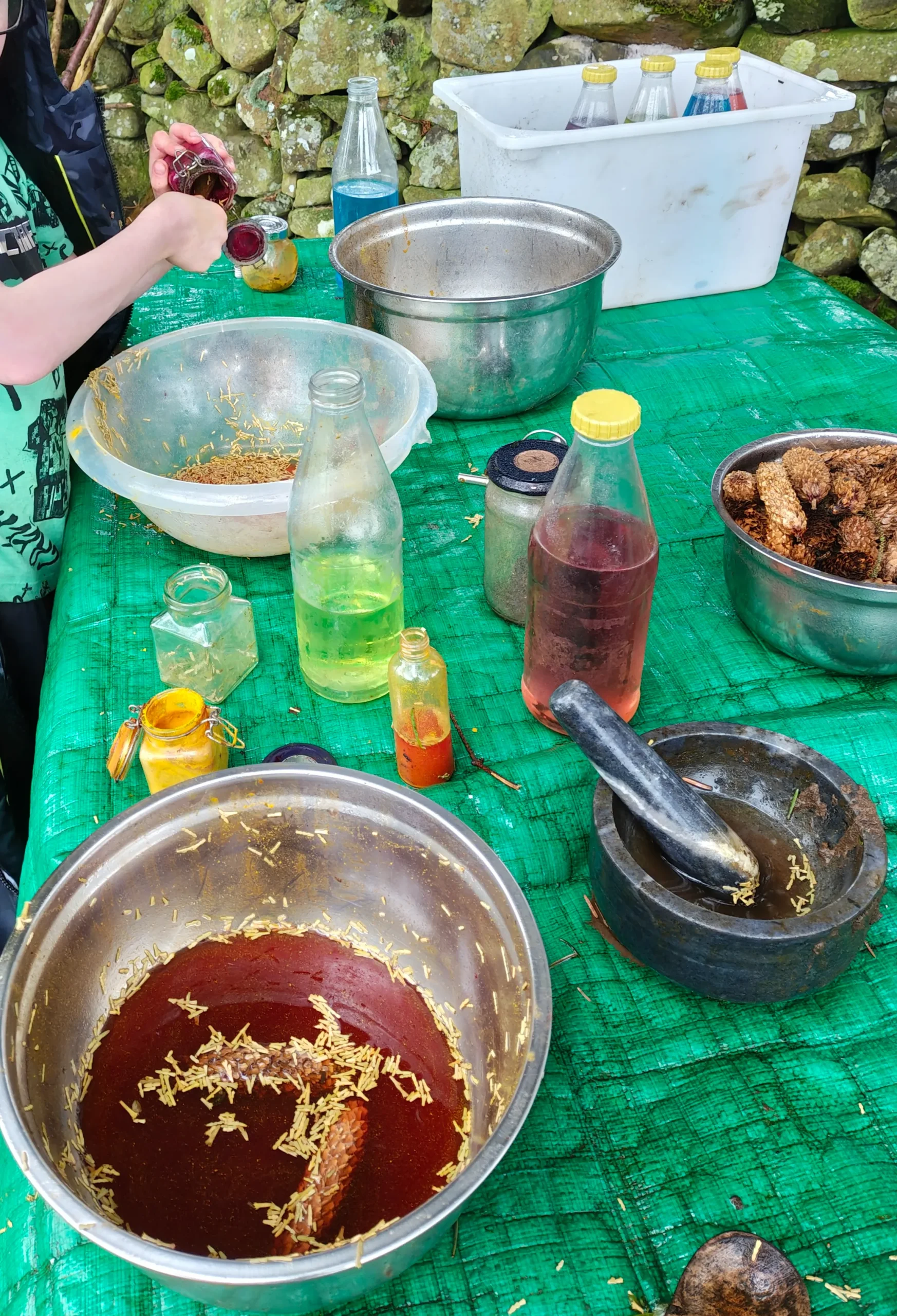 Two children in a barn swing and climb soft play, outdoor learning for wellbeing in a small-group nature play workshop.